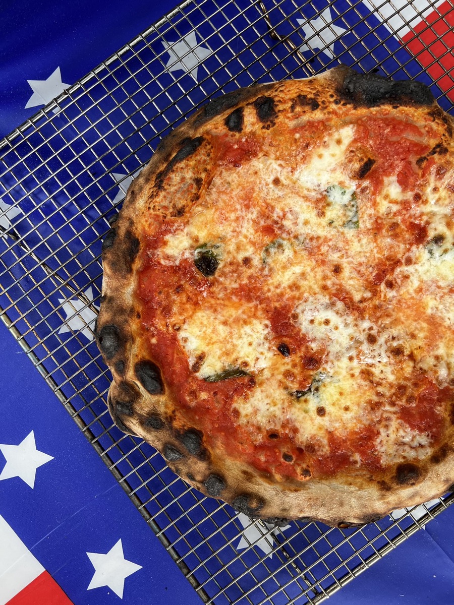Wood-fired pizza on American flag